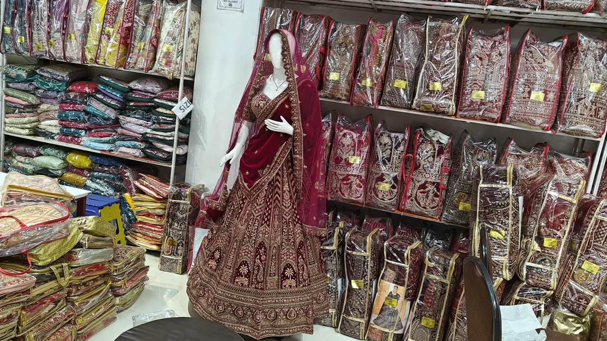 Premium heavy-embroidered bridal lehenga display at Santosh Synthetics for Ranchi wedding season buyers