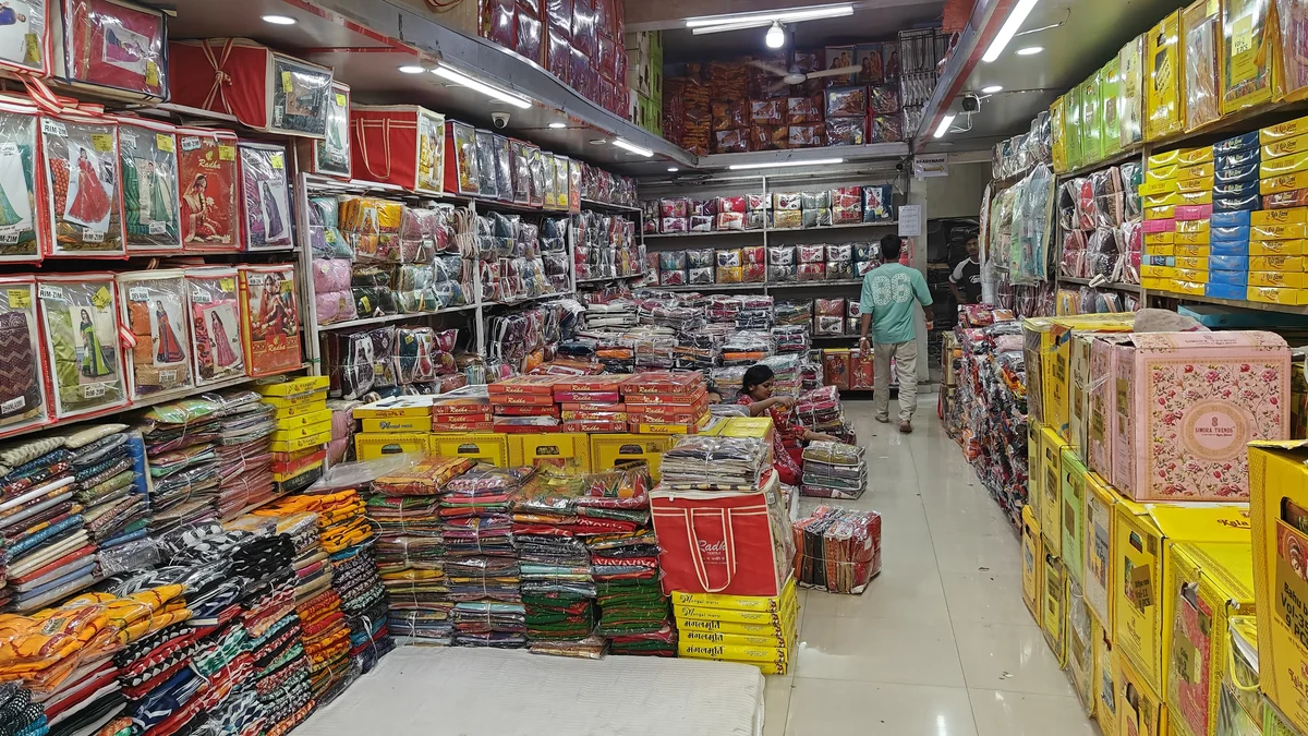 Latest fancy designer sarees wholesale at Santosh Synthetics Jugsalai Jamshedpur for boutique owners