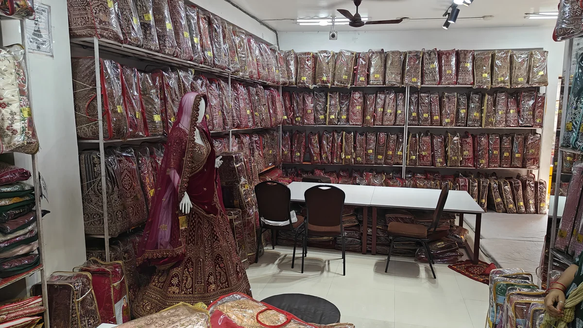 Dedicated lehenga showroom section at Santosh Synthetics — comfortable browsing space for wholesale buyers
